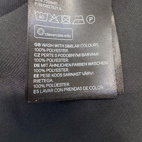 H&M Black Mini Dress. Black hidden front button down. Gold accent cuff buttons - Picture 8 of 8